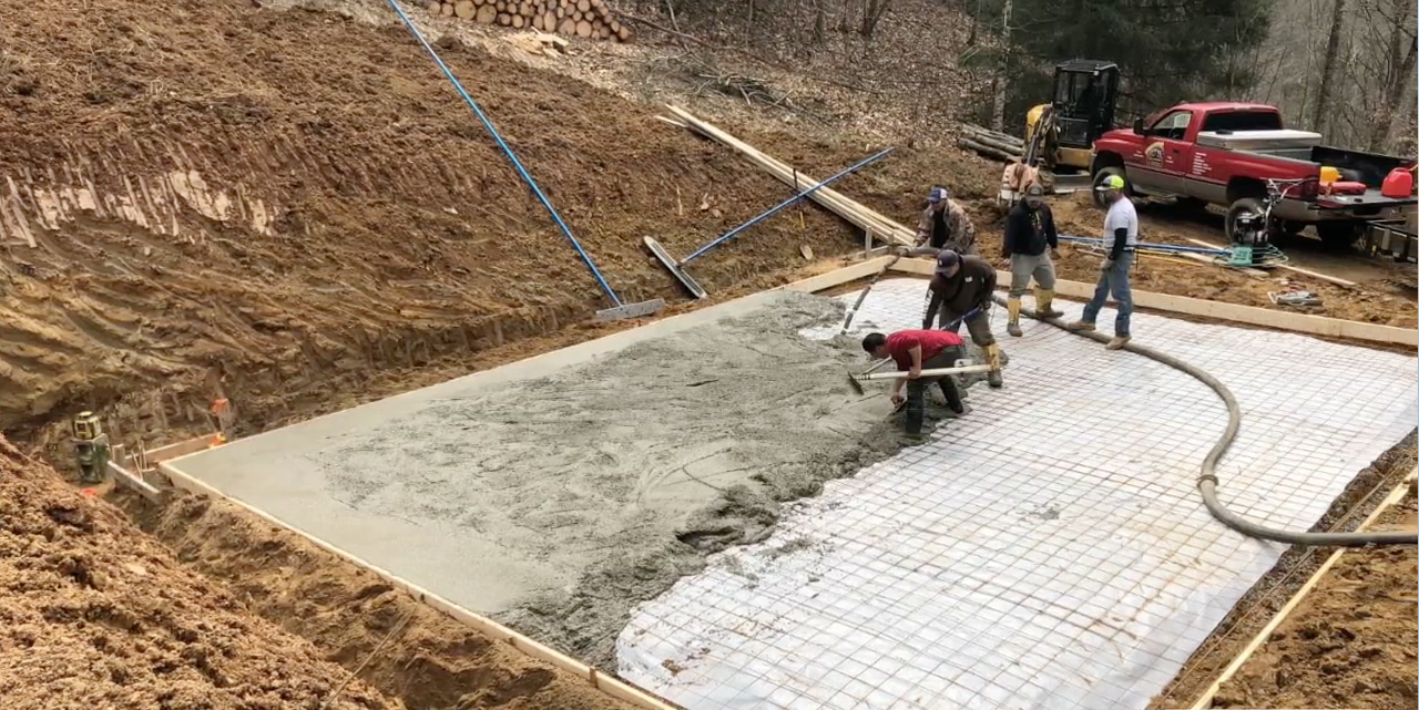 Men leveling a concrete slab